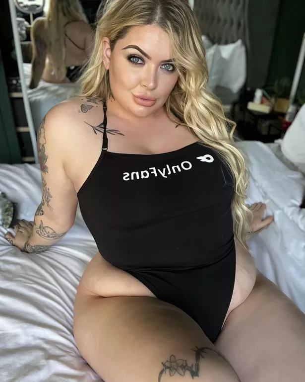 Model Kayla Keen poses in a black OnlyFans leotard